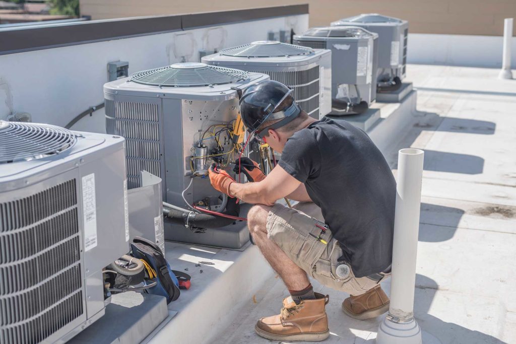 technician working on an HVAC system
