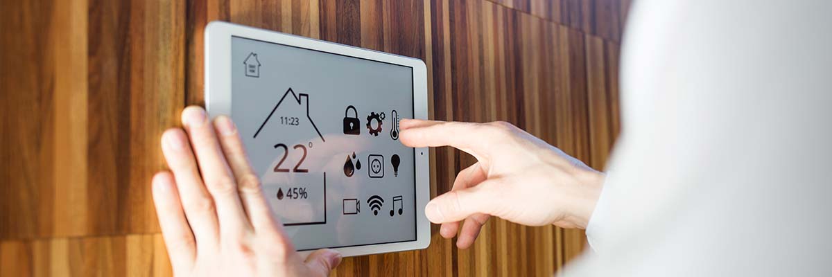 man controls smart home devices using digital tablet man controls smart home devices using digital tablet